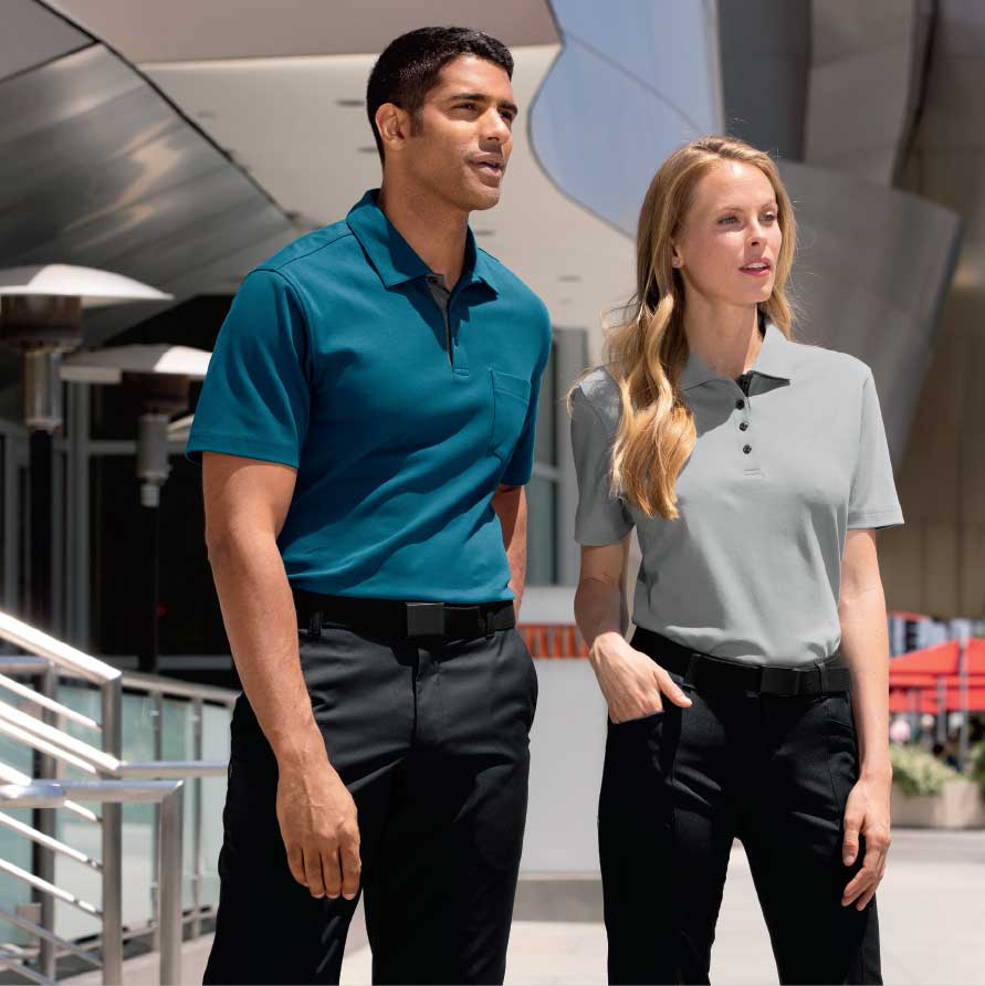 Male and female executives standing wearing executive apparel